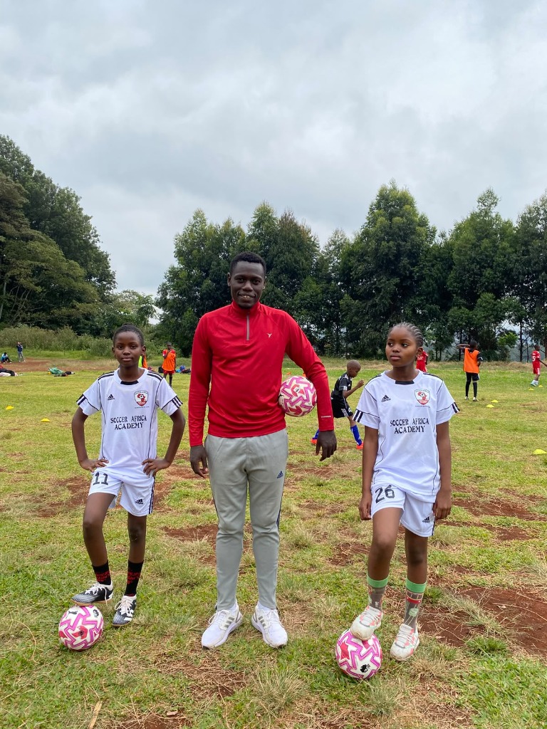 Coach Mich with Soccer Africa Girls Unit Players
