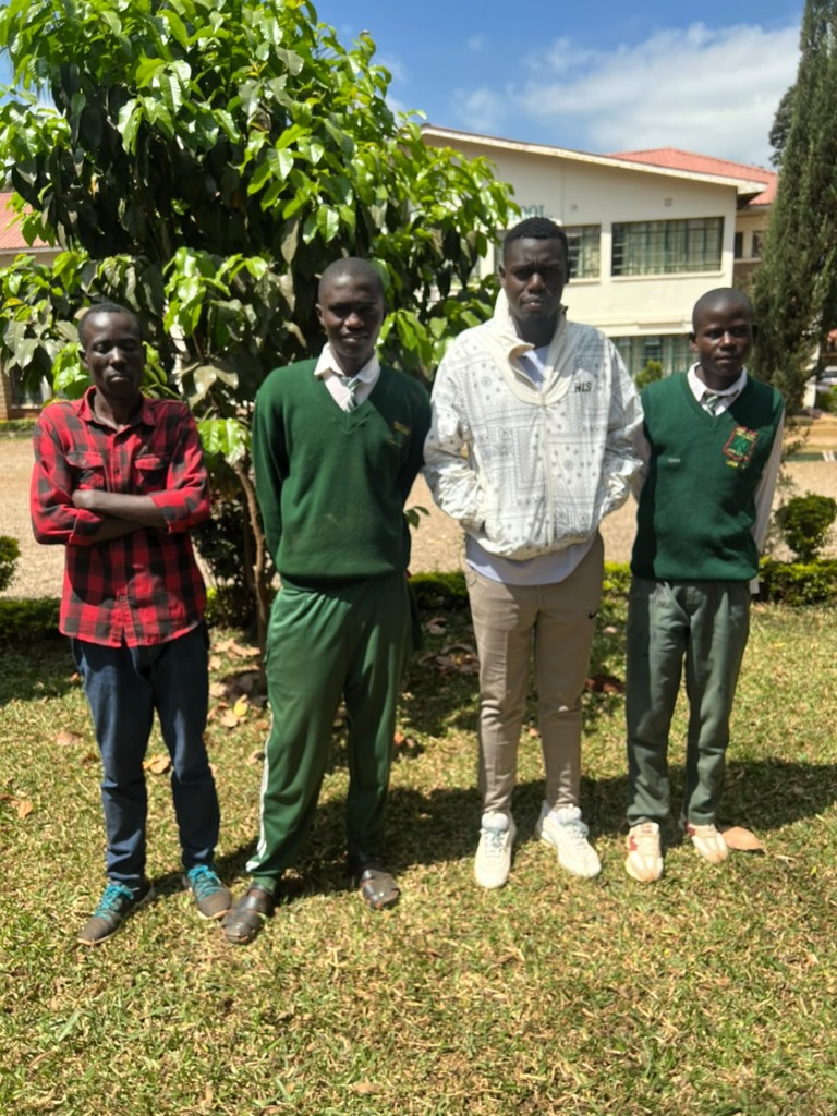 Joel Okhanya and Rason Chitu in Hospital Hill School Uniform with Coach Arnold Maina